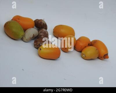 Raw Zehidi Dates with seeds isolated on white background Stock Photo
