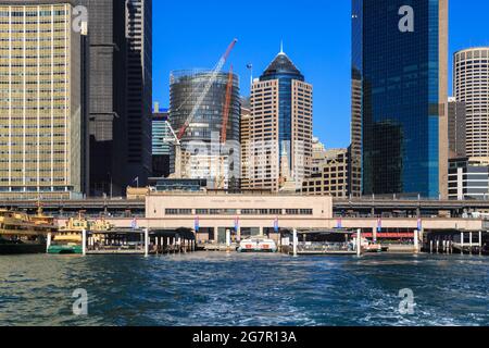 Circular Quay, Sydney, Australia, seen from Sydney Harbour. The skyscrapers of the CBD tower over the railway station Stock Photo