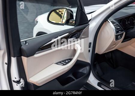 Driver's open car door close up. Control panel on driver's door. Selective focus. Stock Photo