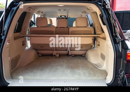 Rear view open car trunk. Large empty flat flor crossover car trunk close up. Huge suv trunk Stock Photo