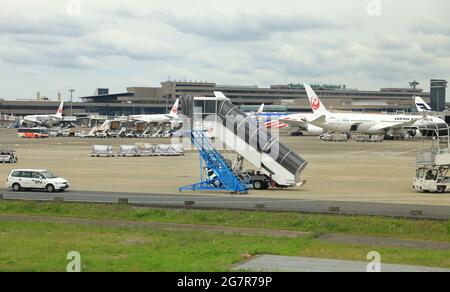 NARITA, JAPAN - MAY 2018 : Ground support equipment standby for services in Apron near aircraft bay. Stock Photo