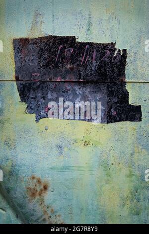 Textural study of a painted sheet iron wall on a 'pang uk', or stilt house, in Tai O, Lantau Island, Hong Kong Stock Photo