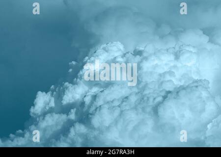 fluffy stormy clouds in the sunset sky Stock Photo
