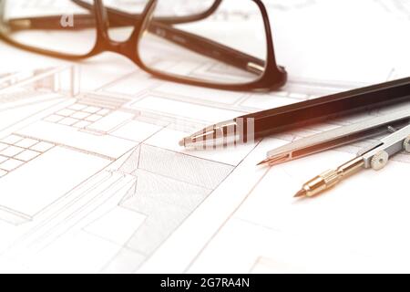Drawings and plans for house construction background with pencil and glasses on the office table Stock Photo
