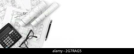 Architectural banner background, sketch plans and blueprints on white office table with calculator, glasses and pen. Top view and copy space Stock Photo