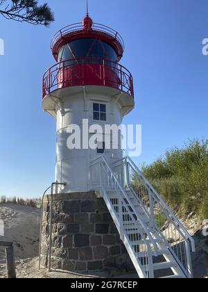 Vertical shot of the small lighthouse Gellen on the island of Hiddensee on a beautiful summer day Stock Photo