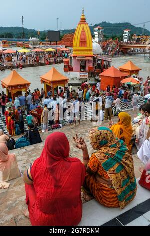 Haridwar, India - July 2021: Pilgrims bathing in the Ganges River at Haridwar on July 14, 2021 in Uttarakhand, India. Stock Photo