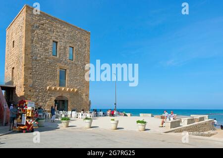 Daytime at Punta Secca Beach with the Torre Scalambri in Santa Croce Camerina, Sicily, Italy Stock Photo