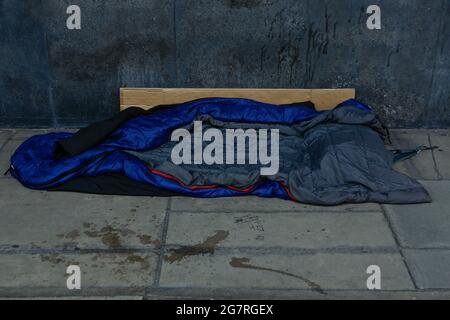 London (UK), 14 July 2021: An unoccupied sleeping bag waits on the Strand in central London The street during the covid crisis. Stock Photo