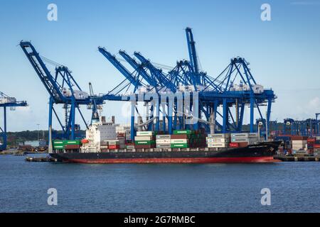 Maersk Wilmington Container Cargo Ship In Port Colon Republic Of Panama Against A Background Of Gantry Container Cranes Stock Photo