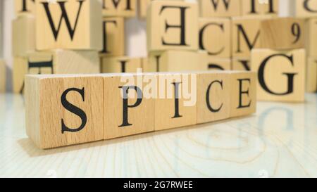 The word Spice was created from wooden letter cubes. Gastronomy and spices. close up. Stock Photo