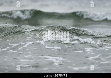 Close up of sea wave in pleasant blue and green tones low angle view water background. Summer holiday concept. Stock Photo