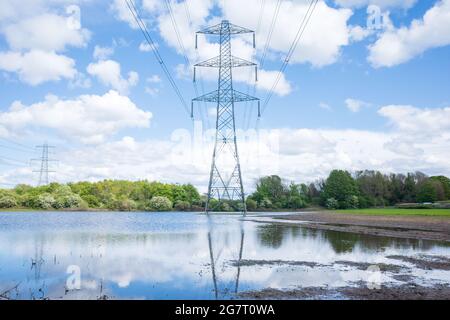 Newburn UK: 24th May 2021: Flooded farmland at Throckley Reef (Reigh) in North England. Flooded field with electricty pylons Stock Photo