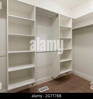 Square frame Interior of an empty walk-in closet room with floor vent Stock Photo
