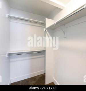 Square frame Interior of an empty walk-in closet with carpet floor Stock Photo