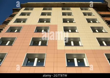 Windows in a house under construction. Plastic windows in the building. Residential apartment building. Stock Photo