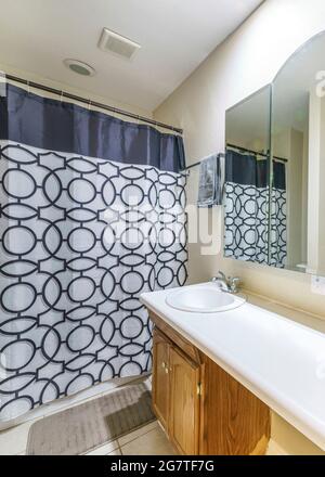 Vertical Double sink with separated wooden vanity in a bathroom Stock Photo