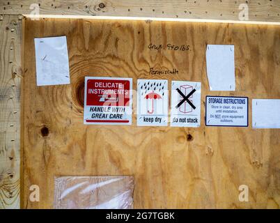 warning label beside transportation wooden box Stock Photo