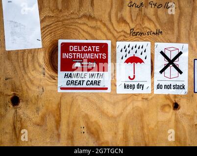 warning label beside transportation wooden box Stock Photo