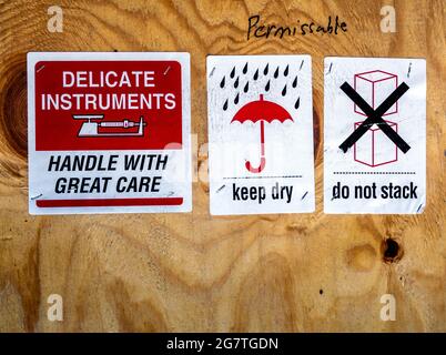 warning label beside transportation wooden box Stock Photo