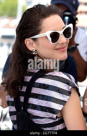 Cannes, France. 10th July, 2021. Marion Cotillard attends the photocall for 'Bigger Than Us' during the 74th Annual Cannes Film Festival at the Palais des Festivals on July 14, 2021 in Cannes, France. Credit: Geisler-Fotopress GmbH/Alamy Live News Stock Photo