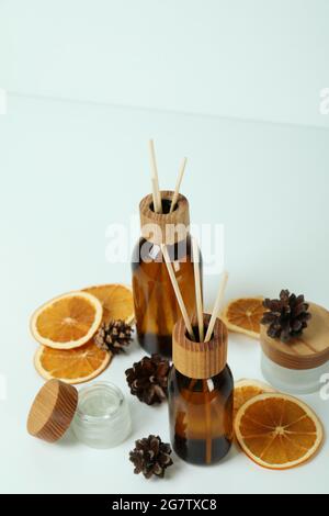 Diffusers, lemons and cones on white background Stock Photo