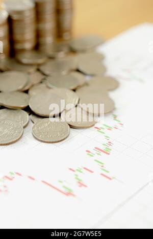 Performance graphs and coins Stock Photo