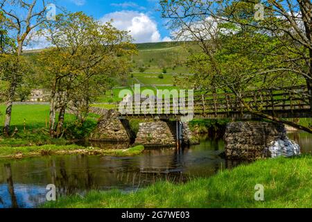 Footbridge over the river Wharfe, near Starbotton, Upper Wharfedale, Yorkshire Dales National Park, Yorkshire, England, UK Stock Photo