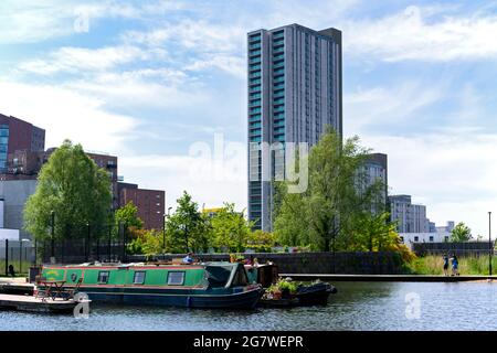 The Oxygen Tower apartment block from the Cotton Field Park marina, New Islington, Ancoats, Manchester, England, UK Stock Photo