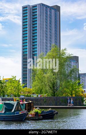 The Oxygen Tower apartment block from the Cotton Field Park marina, New Islington, Ancoats, Manchester, England, UK Stock Photo