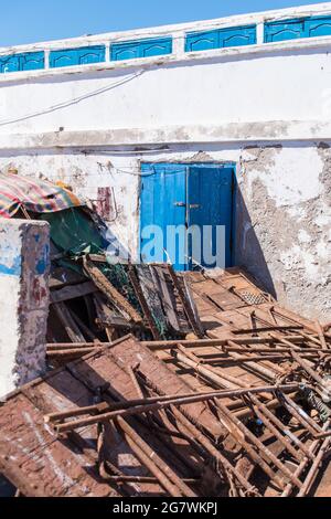 Vertical shot of rusty old staircases at Essaouira Harbor, Morocc Stock Photo