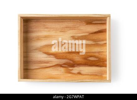 Wooden rectangular serving tray isolated on white background. Simple rustic eco-friendly tableware. Dishware of vintage retro style. Empty wooden tray. Stock Photo