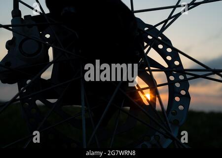 morning bike ride, disc brakes silhouette closeup. Stock Photo