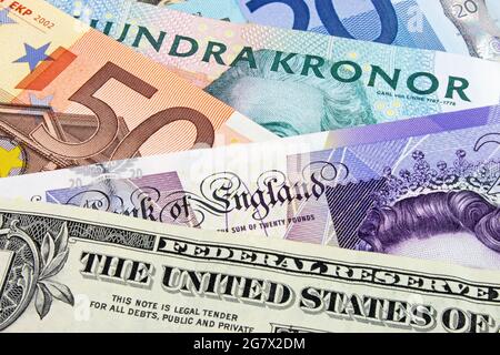 A close-up photograph of  Swedish, United States and Euro currency. Stock Photo