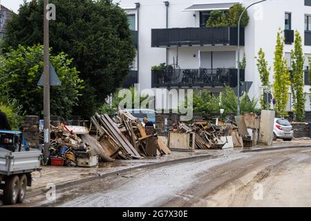 Bad Neuenahr, Germany. 16th July, 2021. Objects destroyed by the flood lie in front of a house. Massive rainfall caused flooding in Bad Neuenahr in Rhineland-Palatinate as well as in the entire district of Ahrweiler. Credit: Philipp von Ditfurth/dpa/Alamy Live News Stock Photo