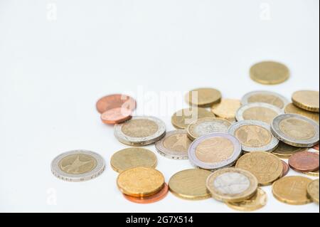 European coins lying on a white surface with copy space Stock Photo