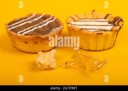 biscuits with cannabis, sweet food with hash oil on yellow background. Stock Photo