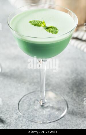 Boozy Refreshing Green Grasshopper Cocktail with Mint and Cream Stock Photo