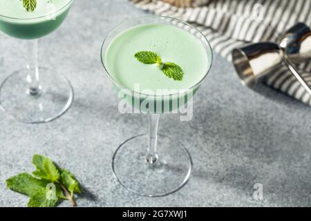 Boozy Refreshing Green Grasshopper Cocktail with Mint and Cream Stock Photo