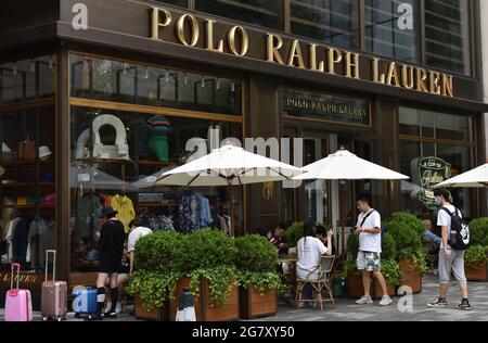 Beijing, China. 16th July, 2021. Pedestrians pass in front of the Polo Ralph Lauren store. (Photo by Sheldon Cooper/SOPA Images/Sipa USA) Credit: Sipa USA/Alamy Live News Stock Photo