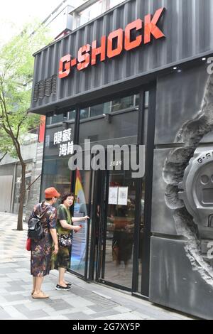 Beijing China. 16th July 2021. Two pedestrians seen in front of