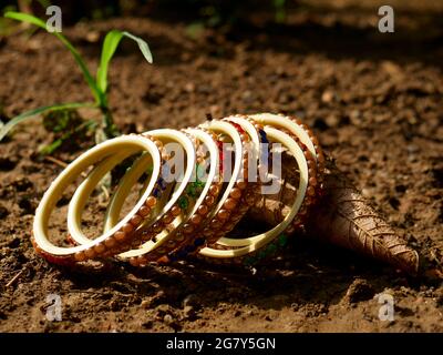 Lady hand ornament in golden pattern displayed isolated at black backdrop, woman lifestyle product natural presentation Stock Photo
