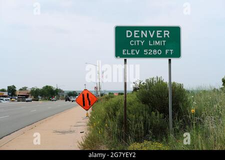 City limit street sign where Aurora, Colorado meets Denver informing visitors of the Mile High City's 5280 foot elevation, one mile above sea level. Stock Photo