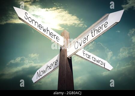 Somewhere, nowhere, over there, far away concept - signpost with four arrows Stock Photo