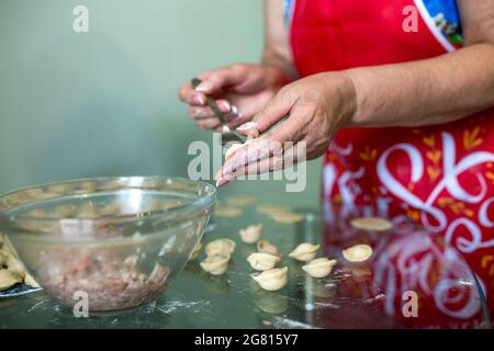 homemade cooking of dumplings with minced meat. Stock Photo