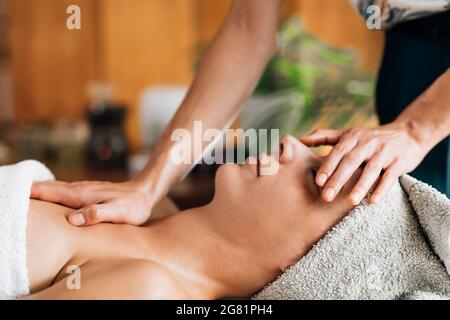 Deep relaxing ayurvedic head, face and chest massage Stock Photo