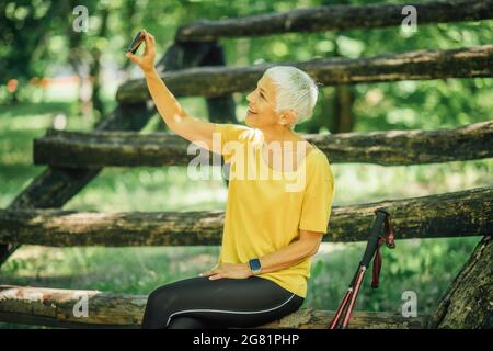 Senior woman taking a break after a workout Stock Photo