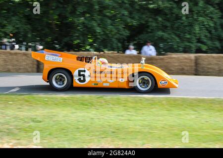 1970 McLaren M8D Can-Am racing up the hill climb at the Goodwood Festival of Speed 2013. Driven by Jenson Button. Denny Hulme Championship winning car Stock Photo