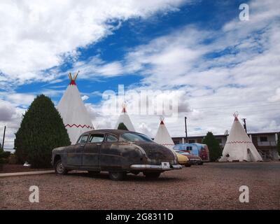 HOLBROOK, ARIZONA - JULY 12, 2018: A 1951 Hudson Hornet, an old Oldsmobile Cutlass, and other antique automobiles are part of the ambience at the vint Stock Photo