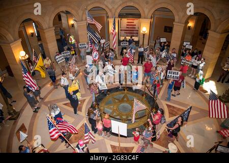 St. Paul, Minnesota. Protesters gather at the capitol rotunda to demand the senate pass the Never Again bill extinguishing Gov Walz’ abusive emergency Stock Photo